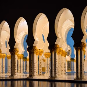 Dramatic view of illuminated arches at Sheikh Zayed Grand Mosque, Abu Dhabi.